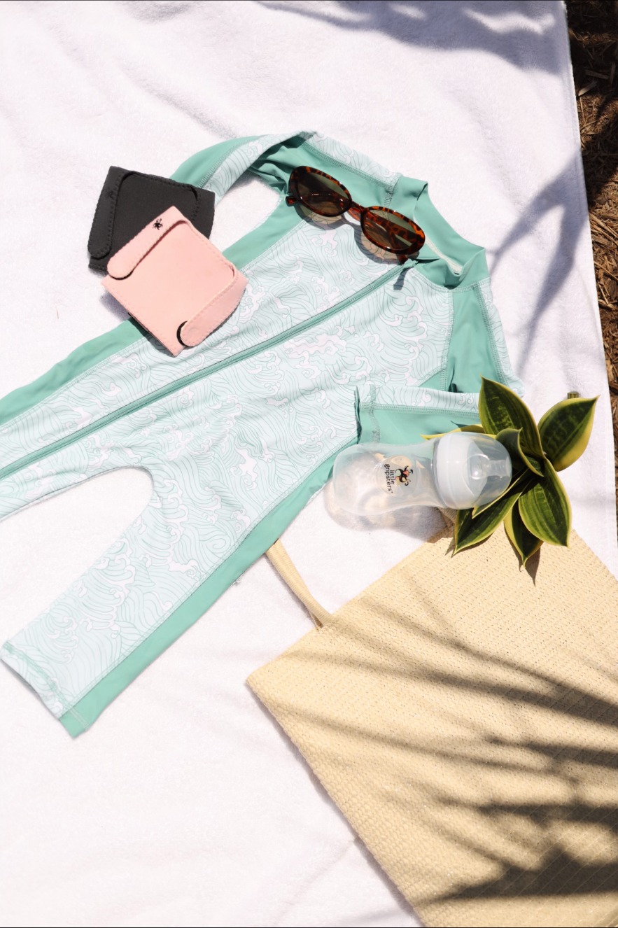 Little Gripsters sleeves in a sunny beach-day flat lay